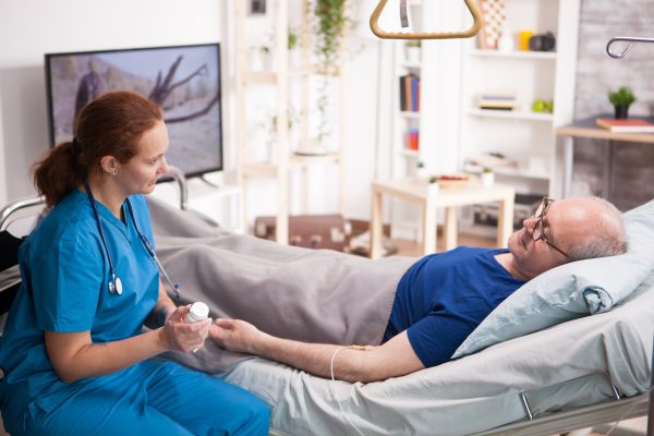 female-doctor-talking-with-old-man-about-his-pills.jpg